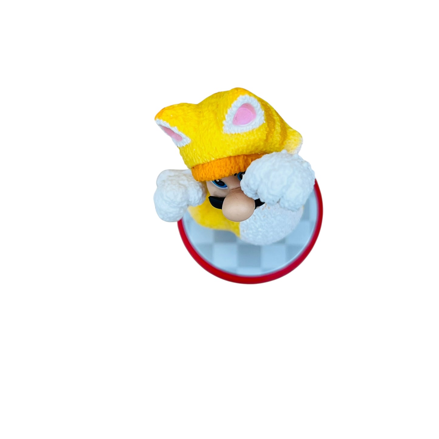 Small figurine with a yellow hat and white gloves on a white background