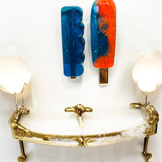 Blue and Orange Hair Clips on a vanity tray