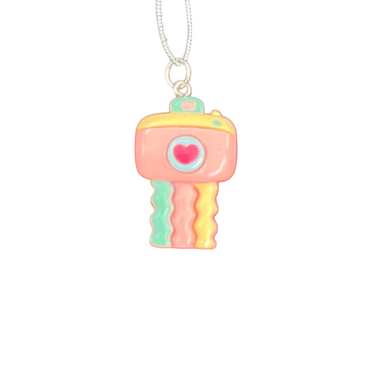 Colorful key-shaped pendant on a white background