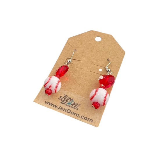 Pair of earrings on a JenDore branded card against a white background