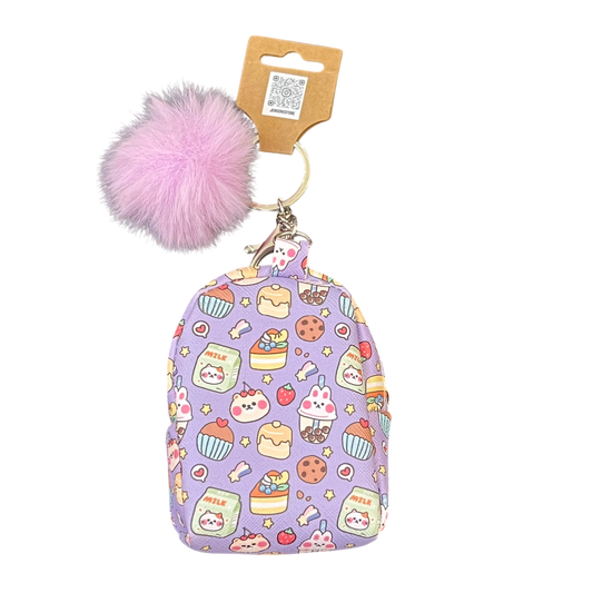 Keychain with purple patterned pouch and pink pom-pom on a white background