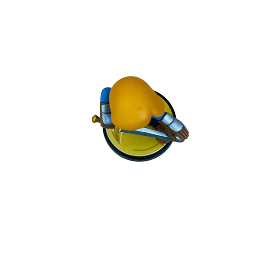 Toy figure of a character with a yellow head and blue outfit on a white background