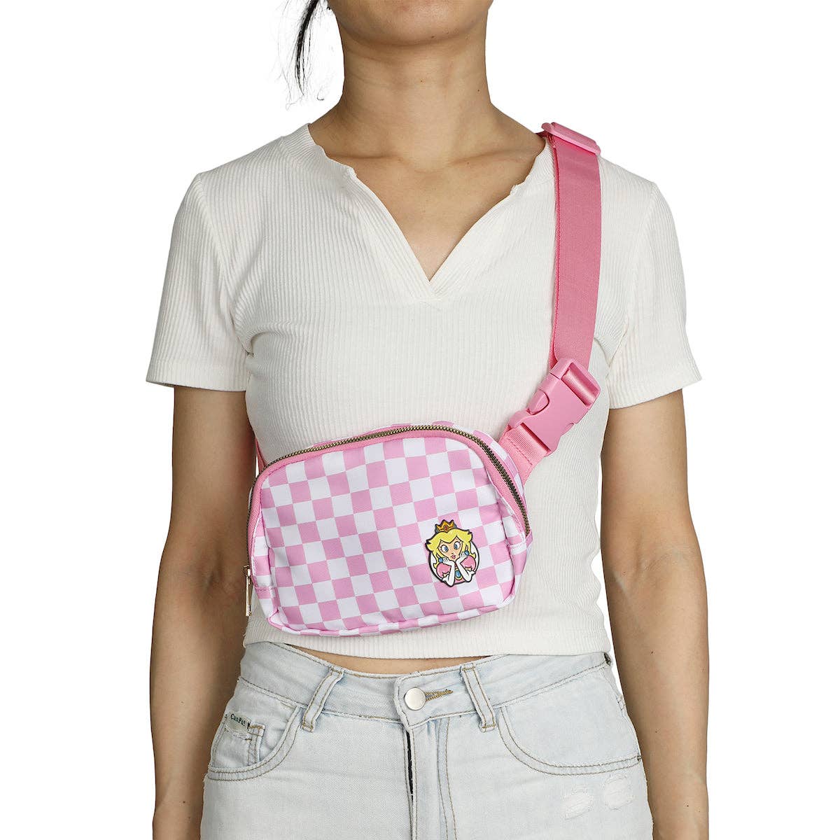 Person wearing a pink checkered crossbody bag with a cartoon character on a white background