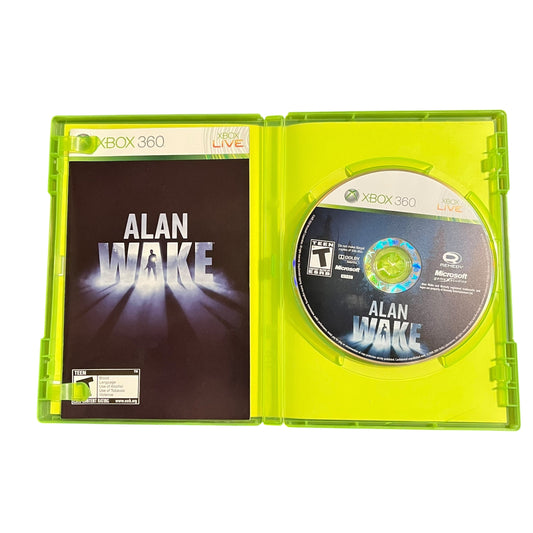 Xbox 360 game disc in a green case titled 'Alan Wake'.