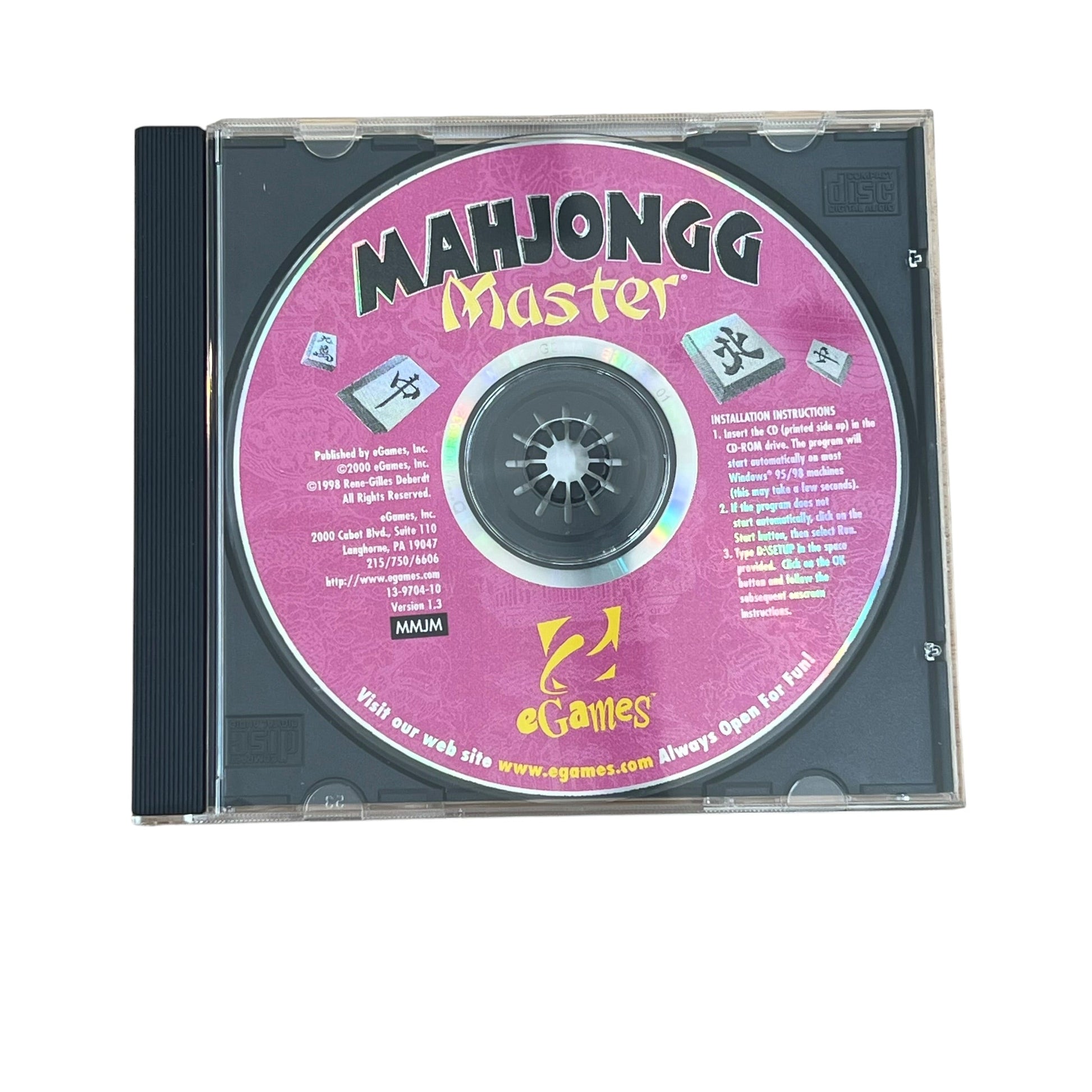 A CD-ROM disc in a clear jewel case with a black tray, featuring a pink label with the text 'Majongg Master' and Chinese characters.
