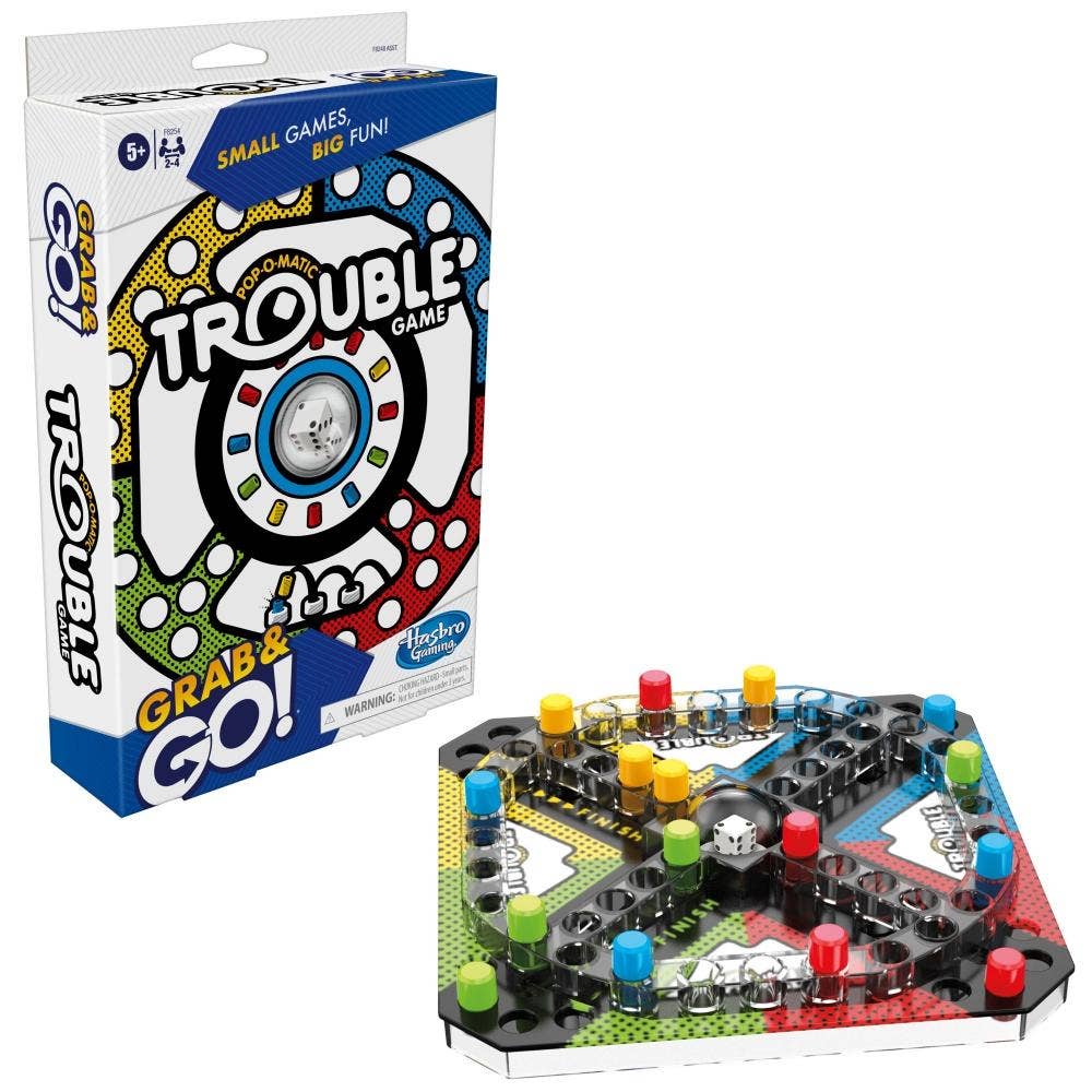 Hasbro Trouble Game Grab & Go! board game shown with its retail box on a white background. The game board is visible in front of the packaging, featuring a colorful hexagonal layout with black pieces, colored tokens, and a central spinner wheel.