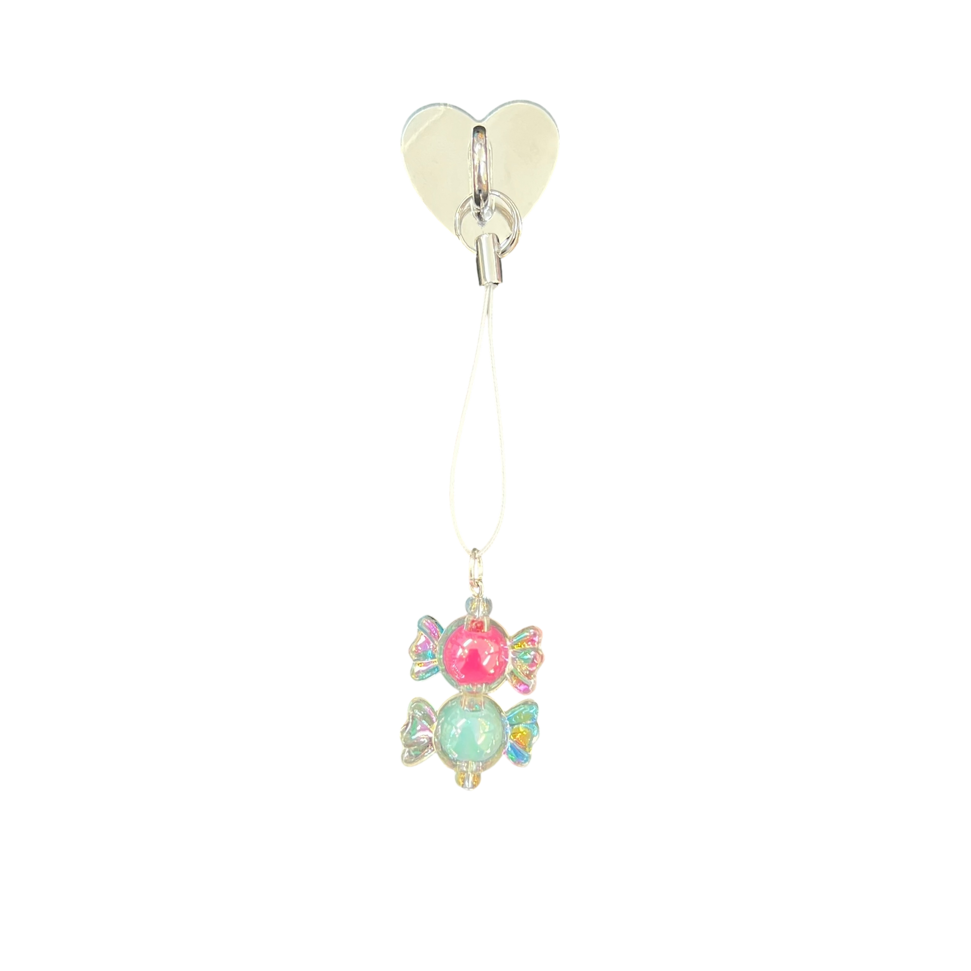 Heart-shaped clip with colorful gemstone pendant on a white background