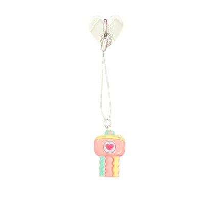 Pastel-colored jellyfish keychain with a heart on a white background
