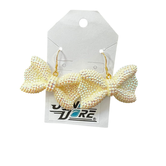 Handmade ivory bow earrings with 18K gold plated stainless steel hooks.