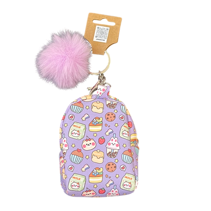 Keychain with purple patterned pouch and pink pom-pom on a white background