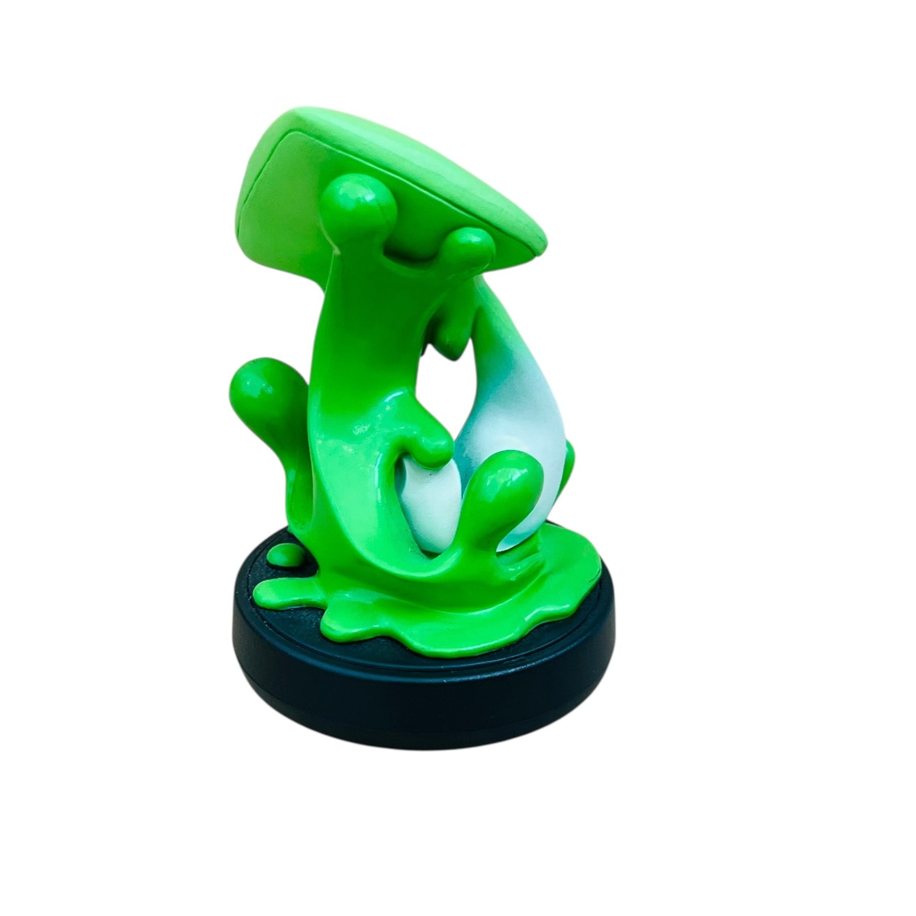 Green toy figure on a white background