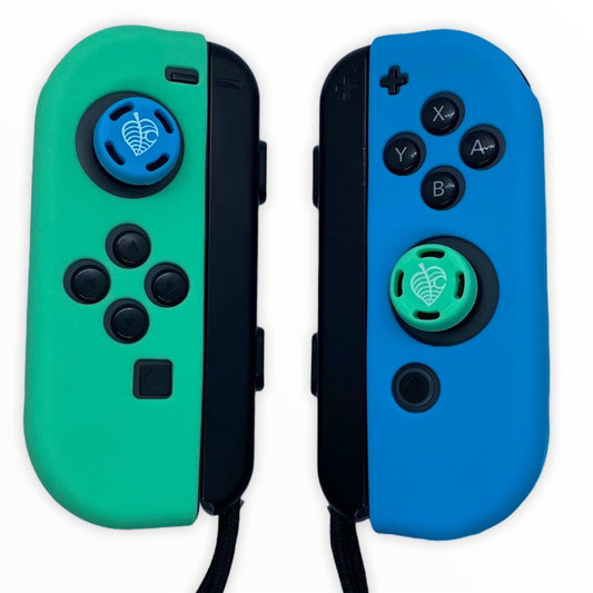 JenDore Juego de fundas protectoras Joy-con de silicona azul y verde para Nintendo Switch y empuñaduras para pulgar